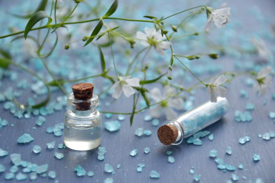 Aromatherapy essential oil bottles and bath salts used in body work treatments