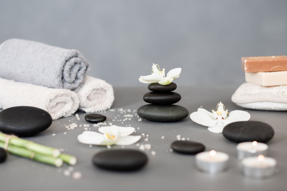 Hot stones and orchids ready for a treatment at Jiameng Spa Huntington