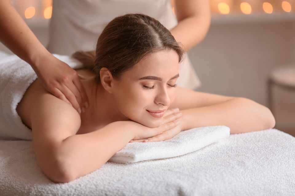 Guest relaxing by candlelight at a Huntington Long Island spa